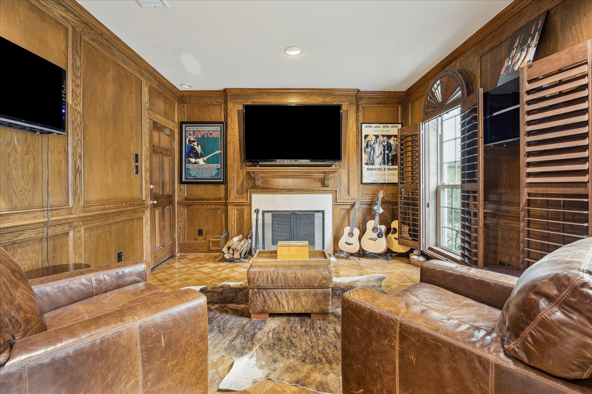 5 Lochtyne Circle Houston, TX 77024 - Photo 5 of 43 a living room with fireplace furniture and a flat screen tv
