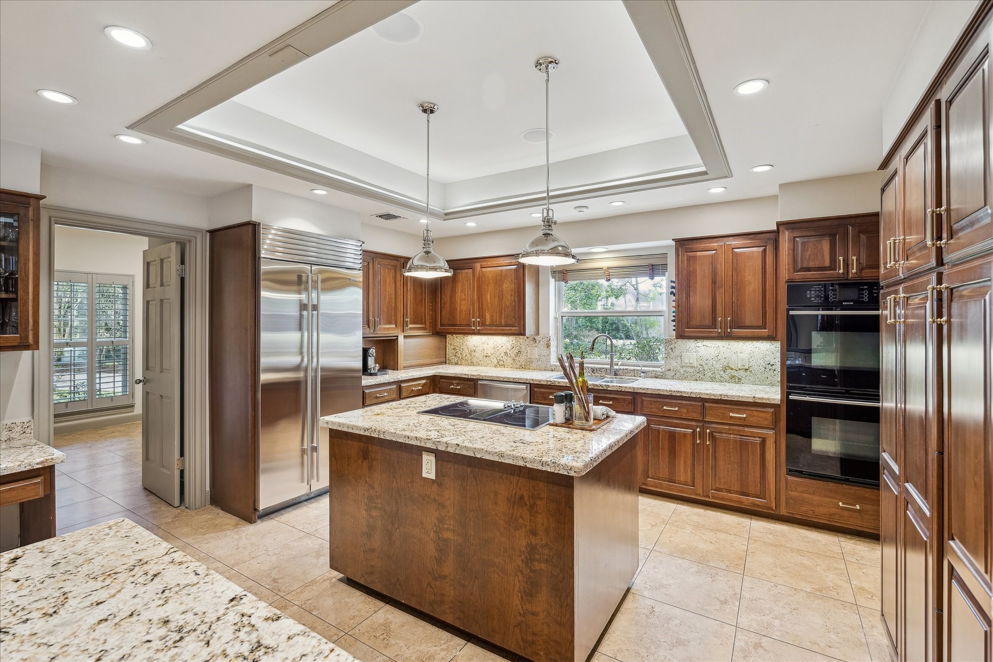 5 Lochtyne Circle Houston, TX 77024 - Photo 9 of 43 a kitchen with stainless steel appliances granite countertop a sink stove and refrigerator