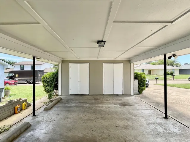a view of a porch with furniture and a gate