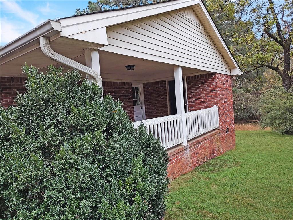 497 Highway 212 Covington, GA 30016 - Photo 2 of 14 a view of a house with a yard and deck