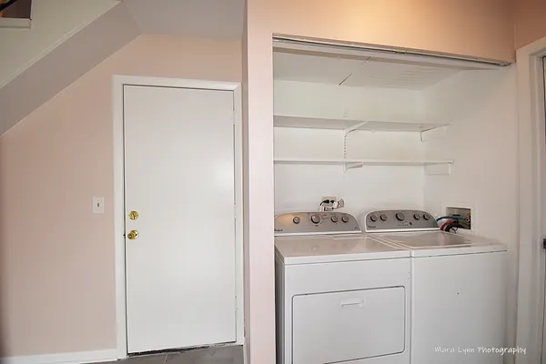 a utility room with dryer and washer