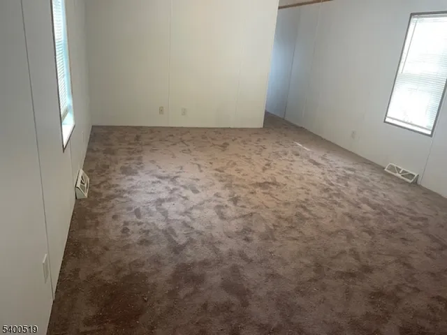 a white toilet sitting next to a shower curtain