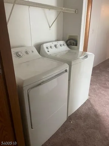 a view of a big room with carpet