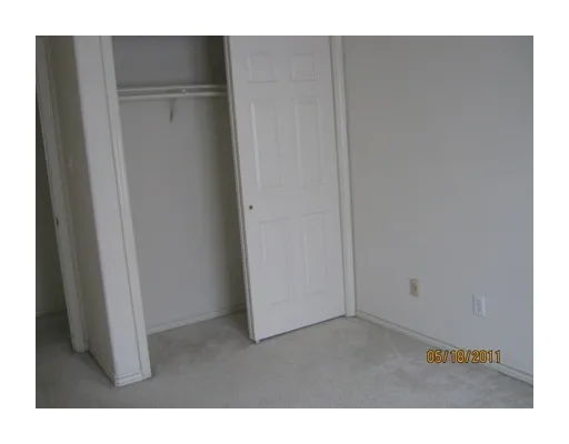 a view of a swimming pool with a lounge chair