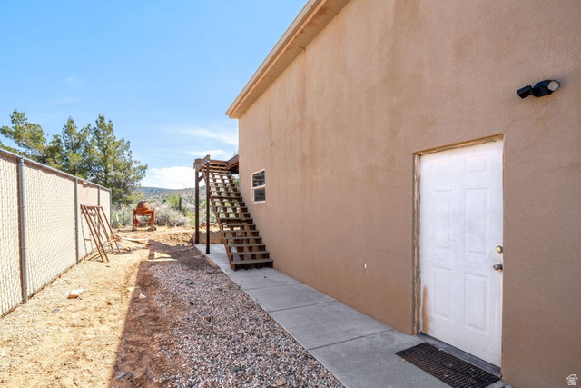 7776 Wagon Road East St. George, UT 84770 - Photo 55 of 76 View of yard featuring stairway