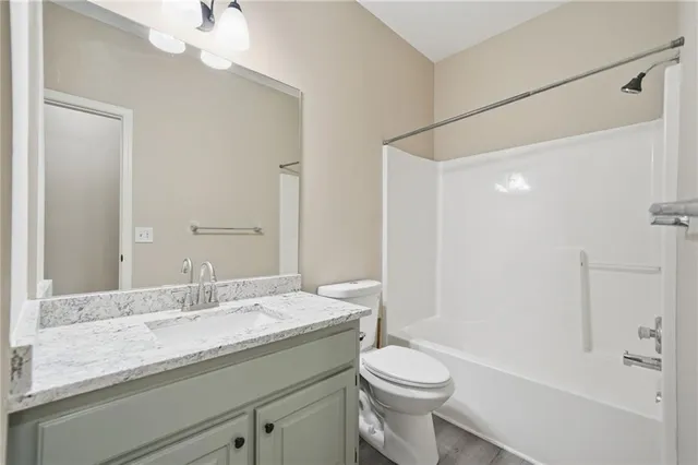 an empty room with a window and a ceiling fan