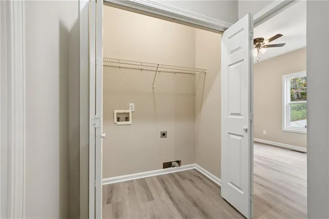 a bedroom with a bed a dresser and a window