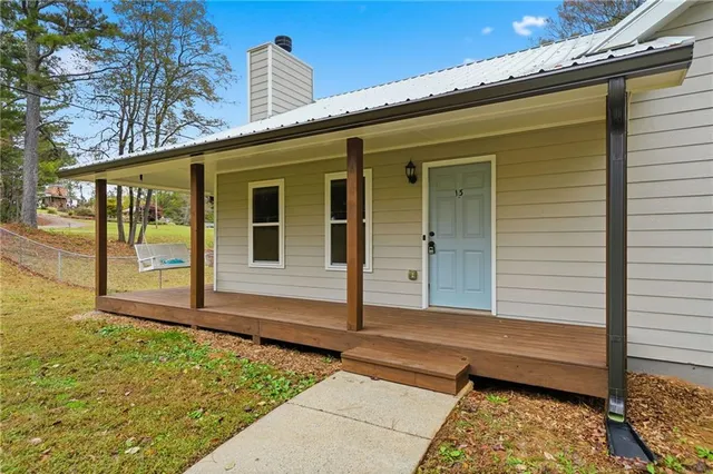 a view of a two chairs in the balcony