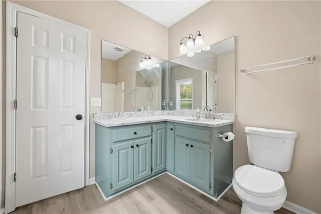 a bathroom with a bath tub with a shower