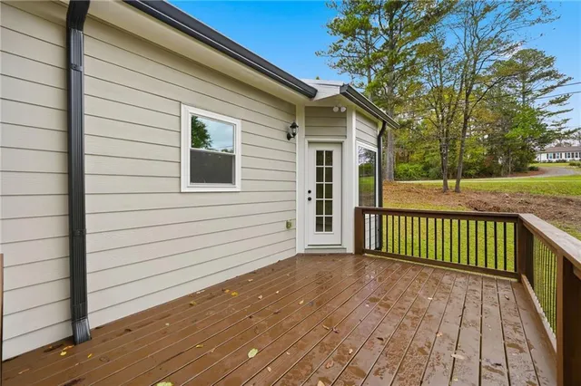 a yellow house with trees in front of it
