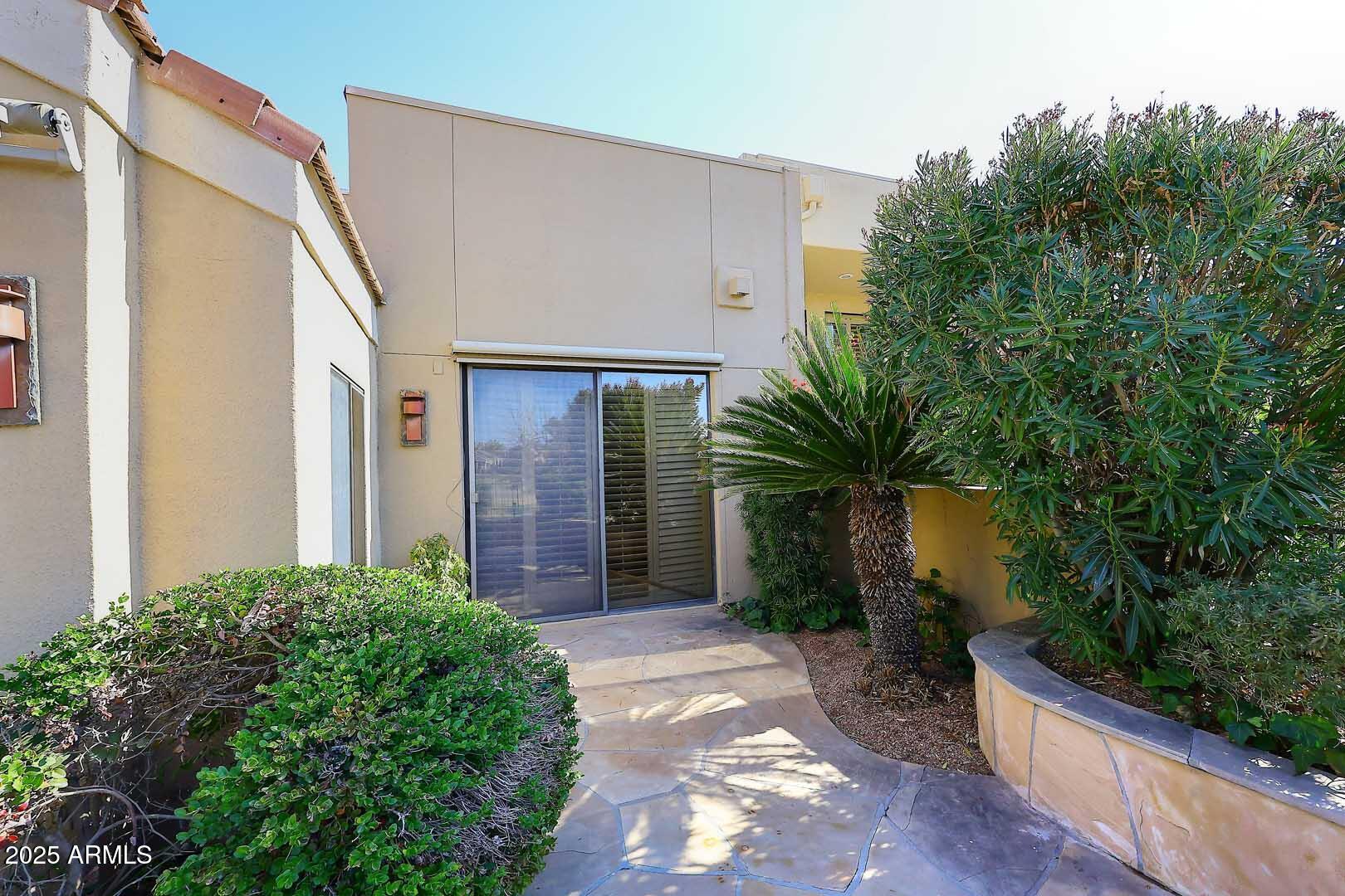 7740 East Gainey Ranch Road, Unit 13 Scottsdale, AZ 85258 - Photo 31 of 51 Primary Bedroom-Patio