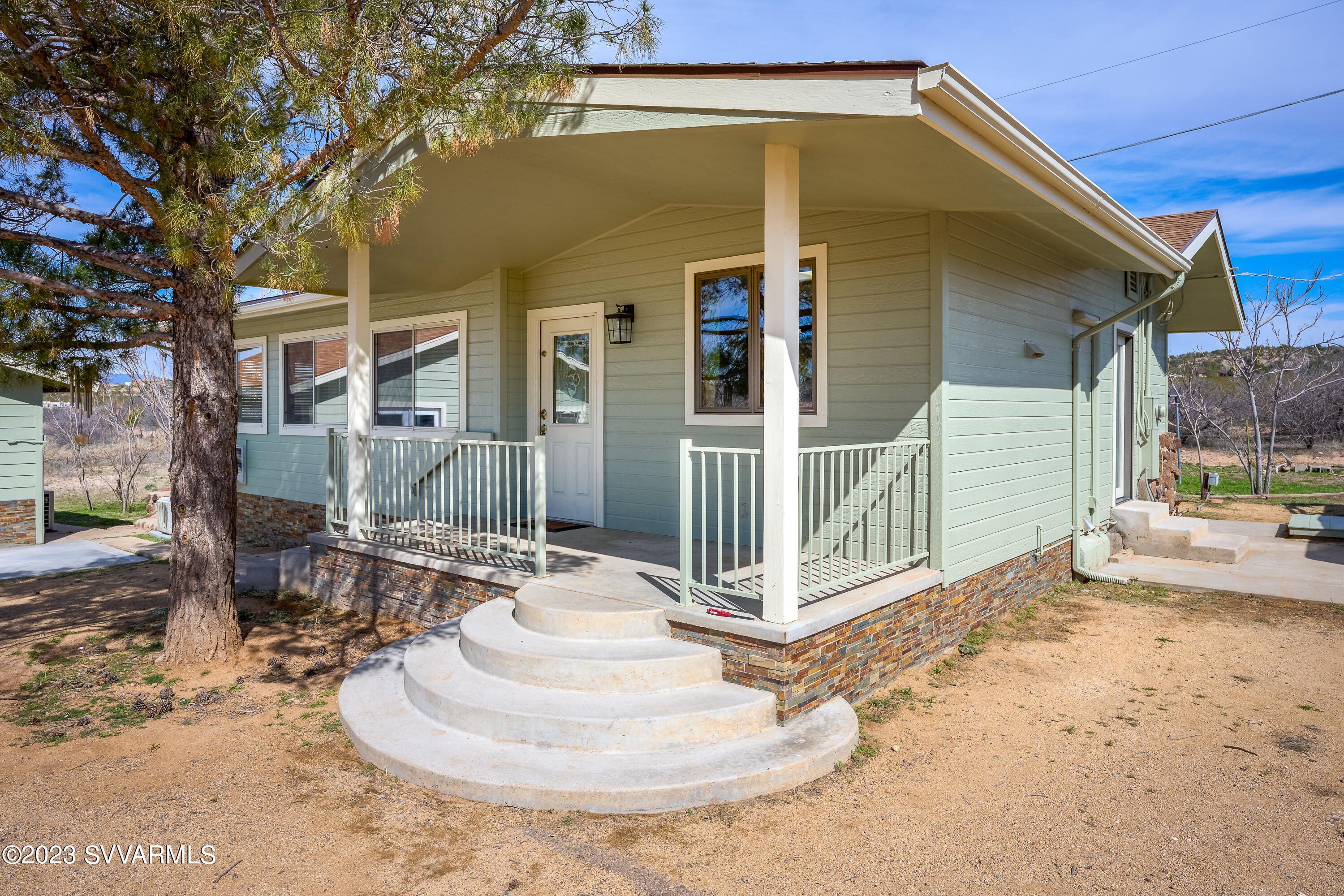 6034 Bice Road Rimrock, AZ 86335 - Photo 15 of 47 a view of a house with a chairs in patio