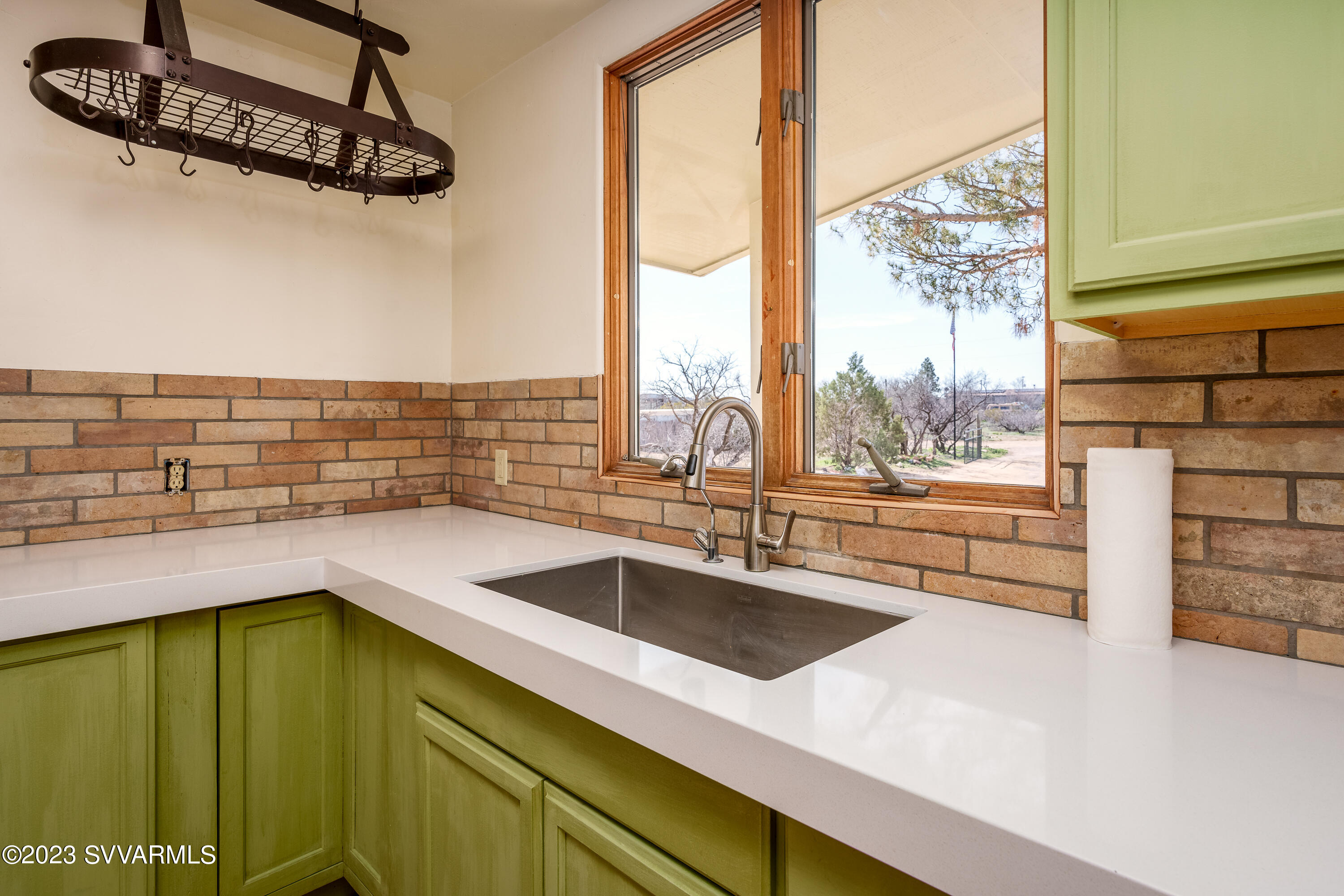 6034 Bice Road Rimrock, AZ 86335 - Photo 23 of 47 a kitchen with stainless steel appliances a sink and a window