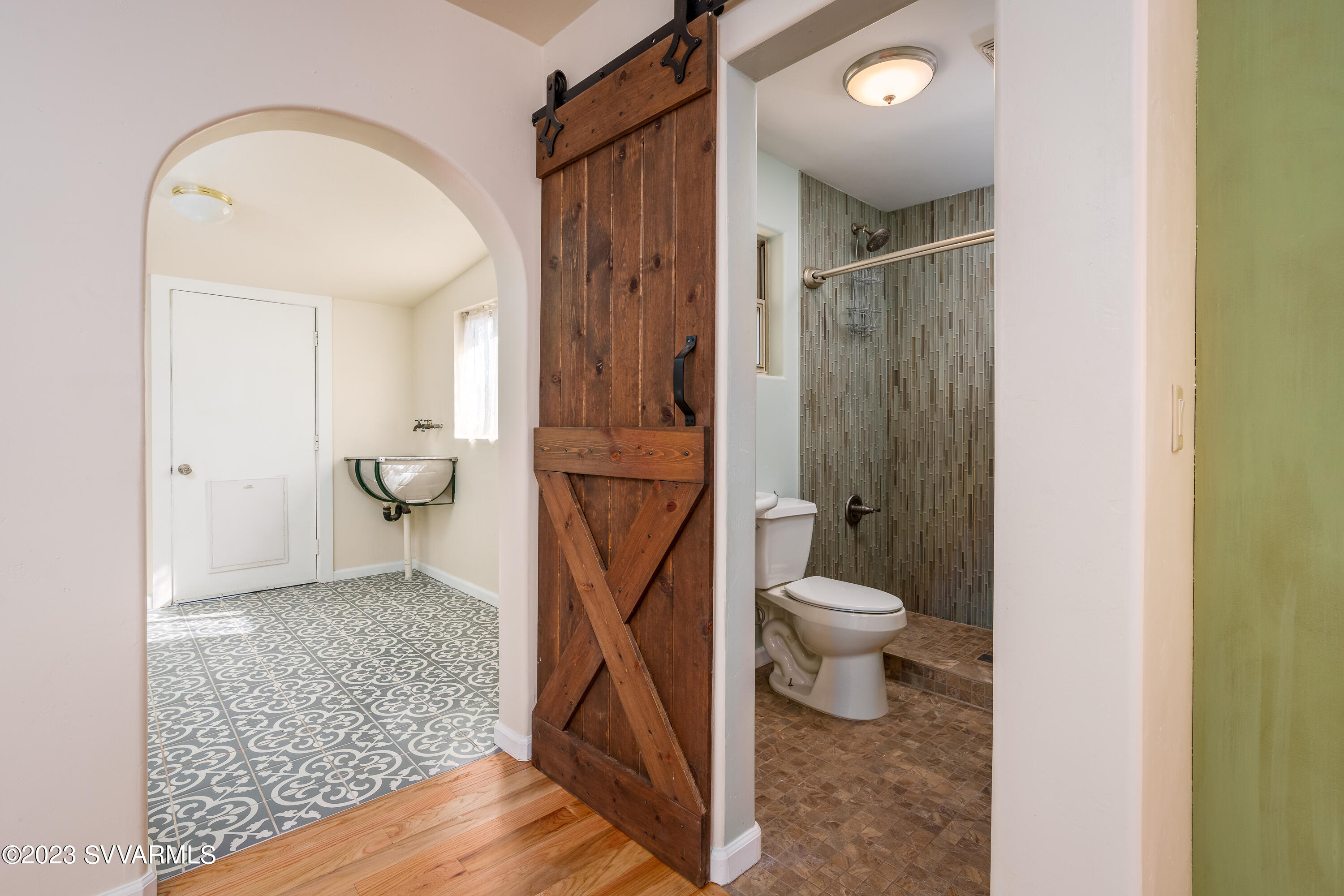 6034 Bice Road Rimrock, AZ 86335 - Photo 25 of 47 a bathroom with a granite countertop toilet a sink and a mirror