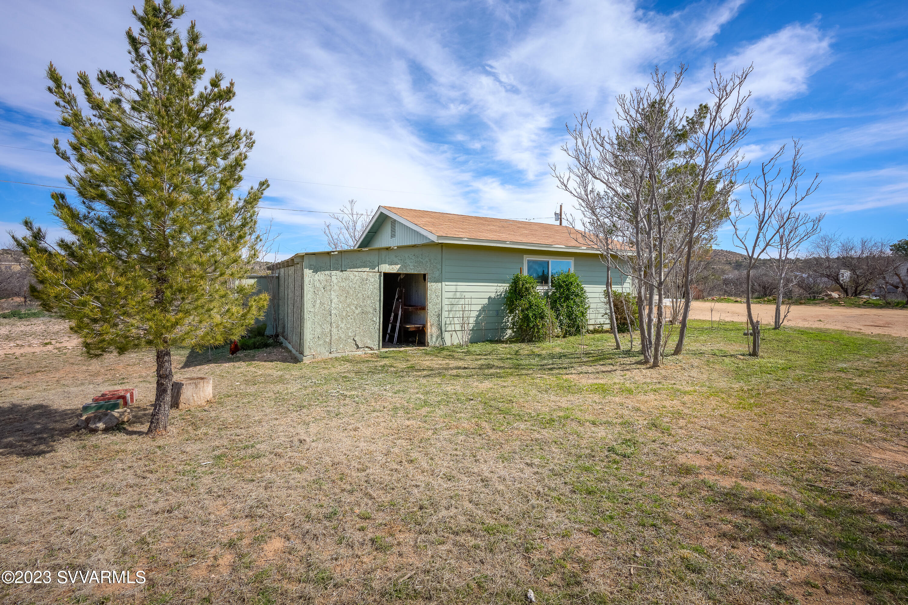 6034 Bice Road Rimrock, AZ 86335 - Photo 45 of 47 a view of a house with yard and a tree