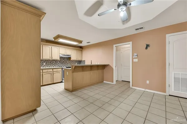 a kitchen with a sink cabinets and window