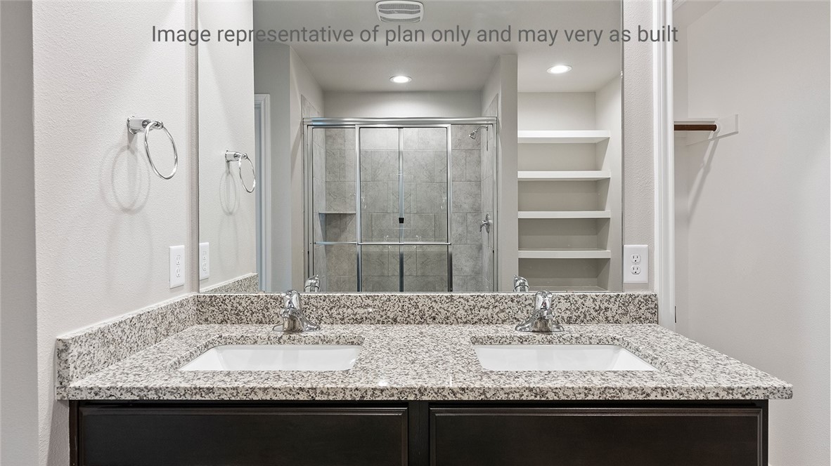 1411 Choctaw Road Sinton, TX 78387 - Photo 19 of 28 a bathroom with a granite countertop sink and a mirror