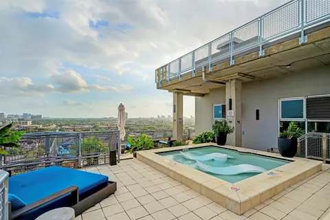 a view of roof deck with seating space