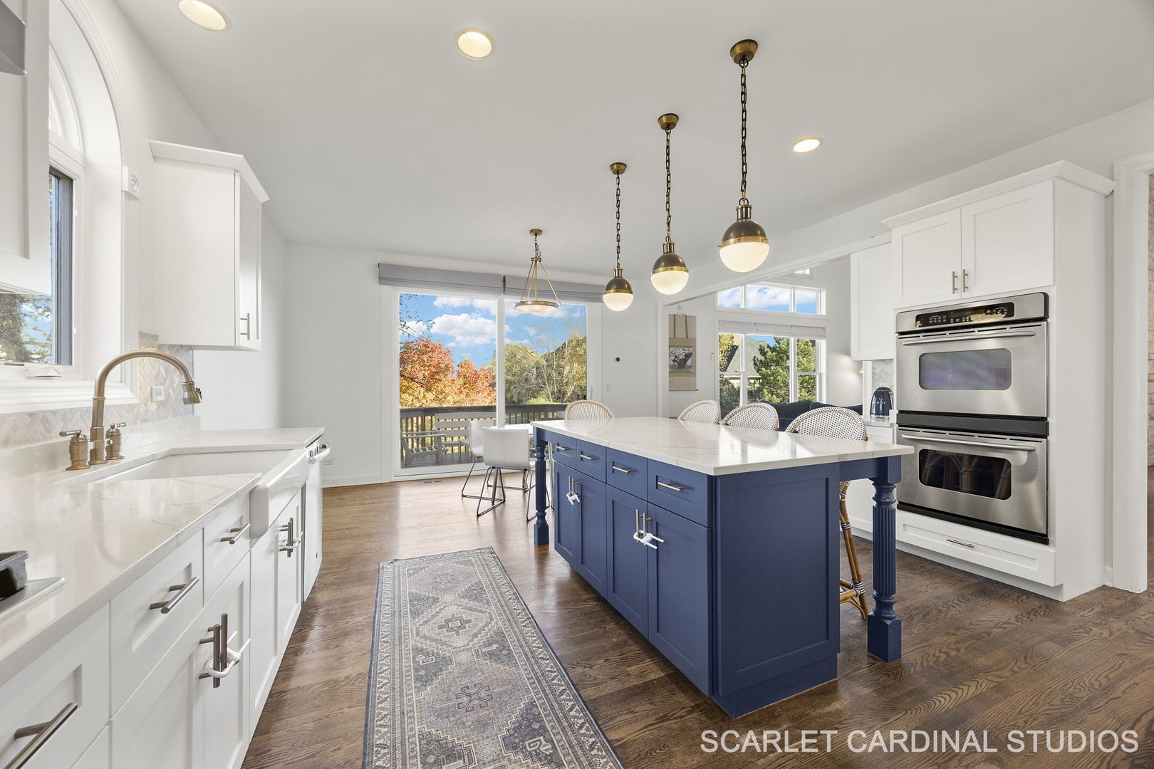 5125 Radcliff Road Lisle, IL 60532 - Photo 11 of 37 a kitchen with stainless steel appliances granite countertop a sink a stove and a wooden floor