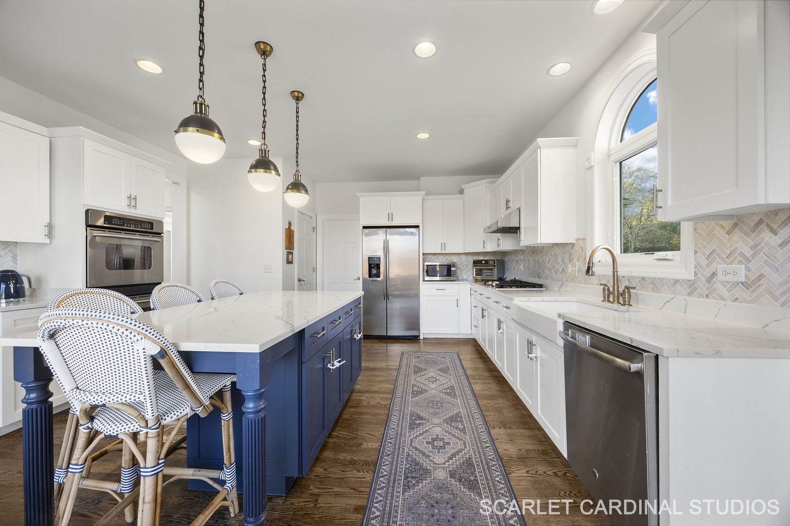 5125 Radcliff Road Lisle, IL 60532 - Photo 12 of 37 a large kitchen with kitchen island a large island in the center and stainless steel appliances
