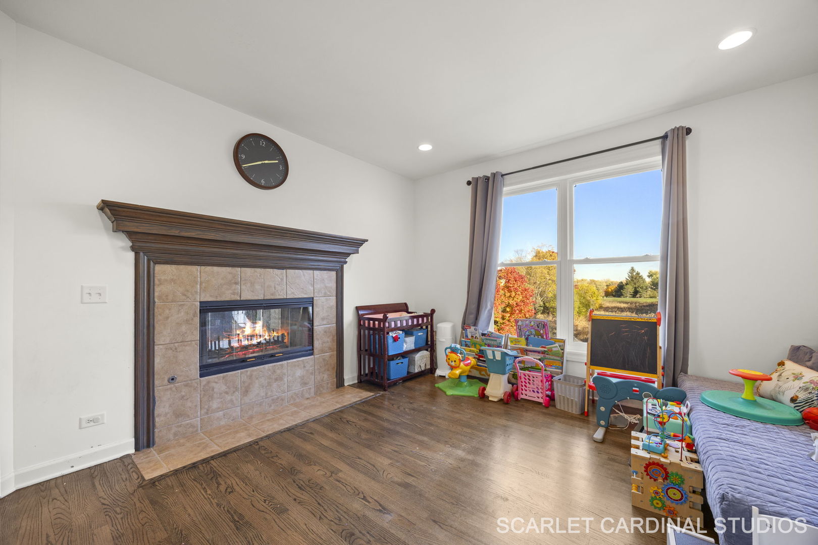 5125 Radcliff Road Lisle, IL 60532 - Photo 16 of 37 a room with wooden floor and a fireplace