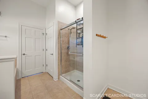 a bathroom with a shower and a sink