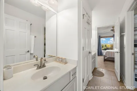a en suite bathroom with a sink and a mirror