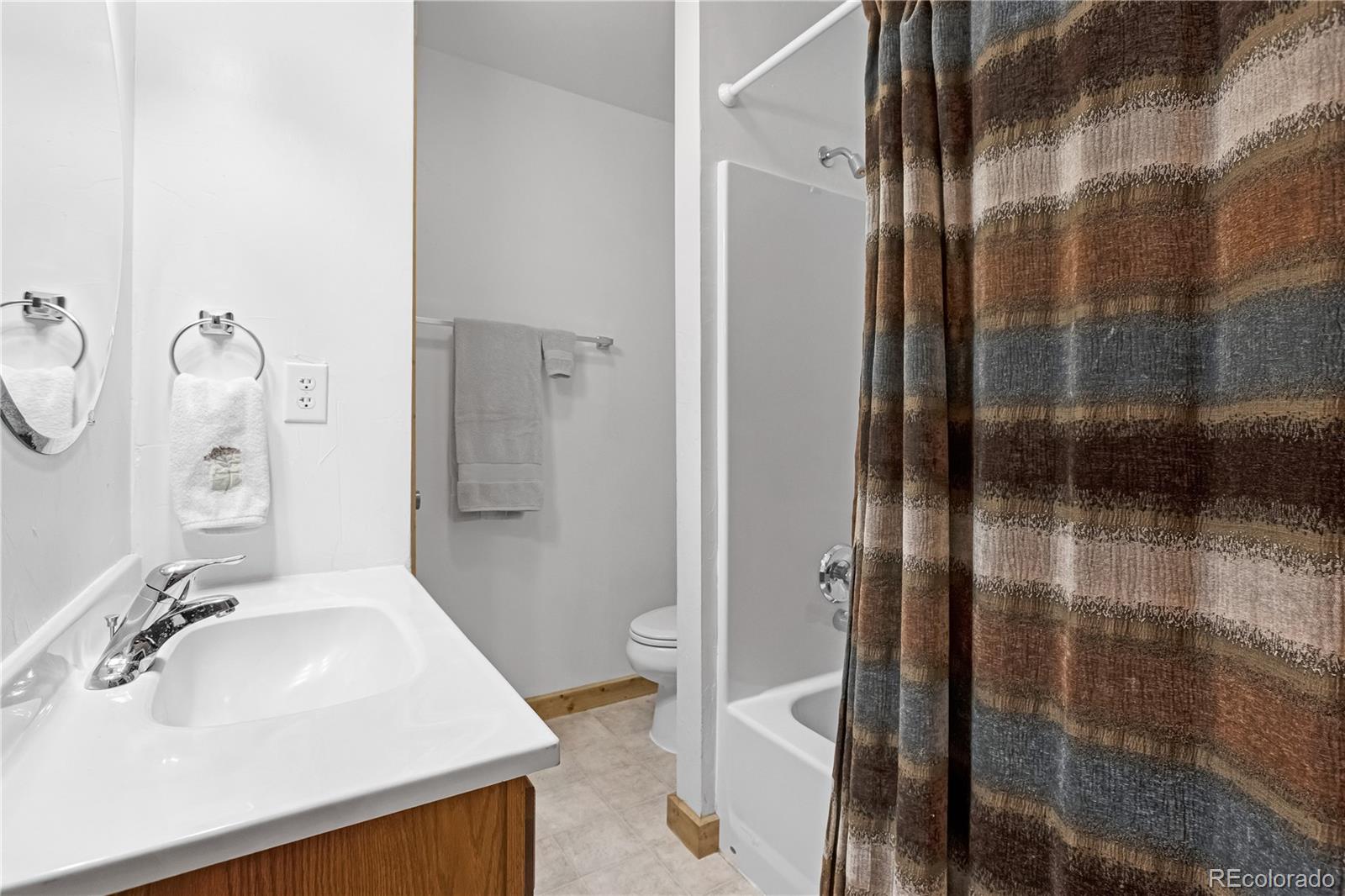 83 Forest Lane Howard, CO 81233 - Photo 20 of 43 a bathroom with a sink and glass door shower