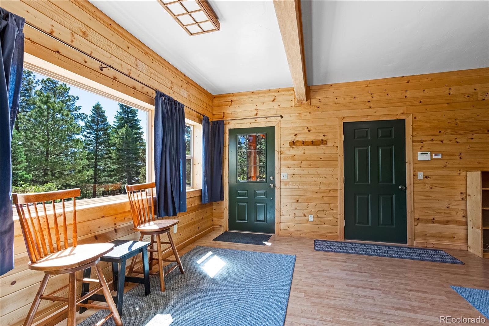 83 Forest Lane Howard, CO 81233 - Photo 26 of 43 a view of a porch with chairs and backyard