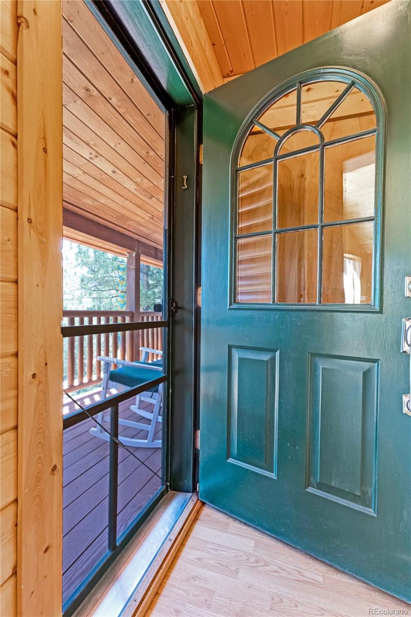 83 Forest Lane Howard, CO 81233 - Photo 4 of 43 a view of a room with wooden floor and windows