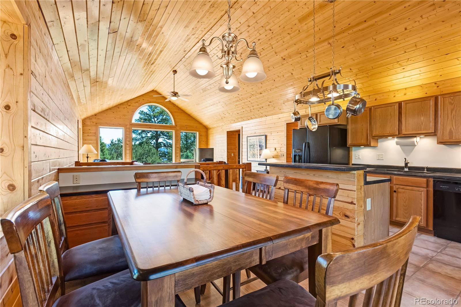 83 Forest Lane Howard, CO 81233 - Photo 9 of 43 a view of a dining room with furniture and wooden floor