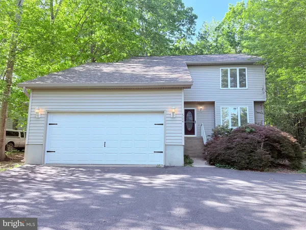 a backyard of a house with yard and garage