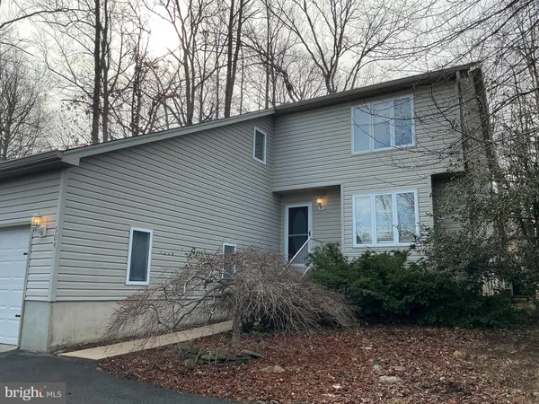 a front view of house with yard