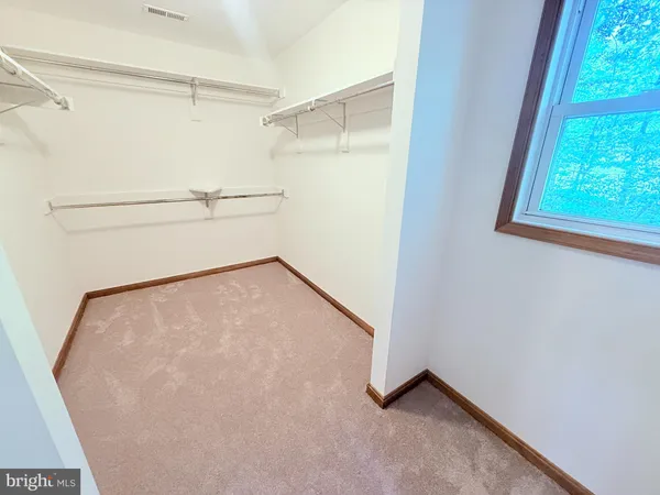 a bathroom with a sink a toilet a mirror and a tub