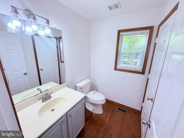 a utility room with cabinets washer and dryer