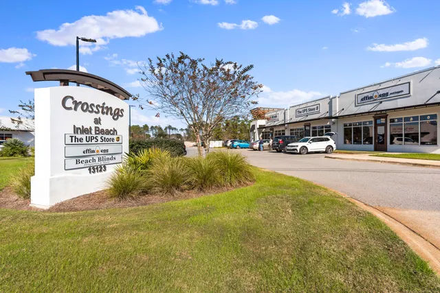 a view of a building with a yard