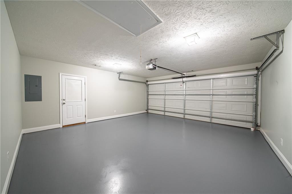 1927 Lee Road Salem, AL 36874 - Photo 15 of 45 Garage with baseboards and electric panel