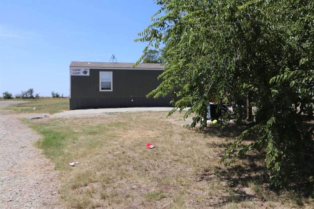 14641 Songbird Lane Haslet, TX 76052 - Photo 10 of 25 a backyard of a house with lots of green space