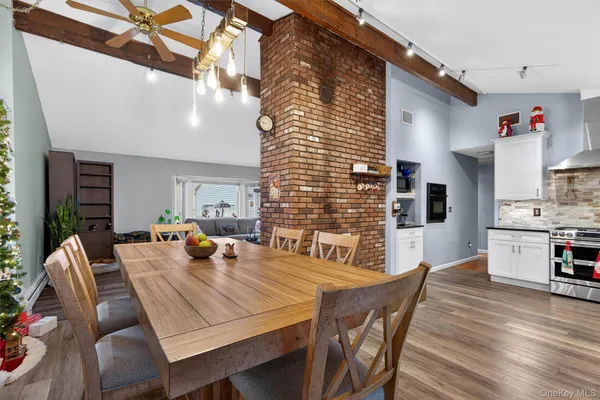 a kitchen with stainless steel appliances granite countertop a stove and cabinets