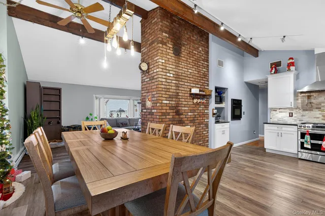 a kitchen with stainless steel appliances granite countertop a stove and cabinets