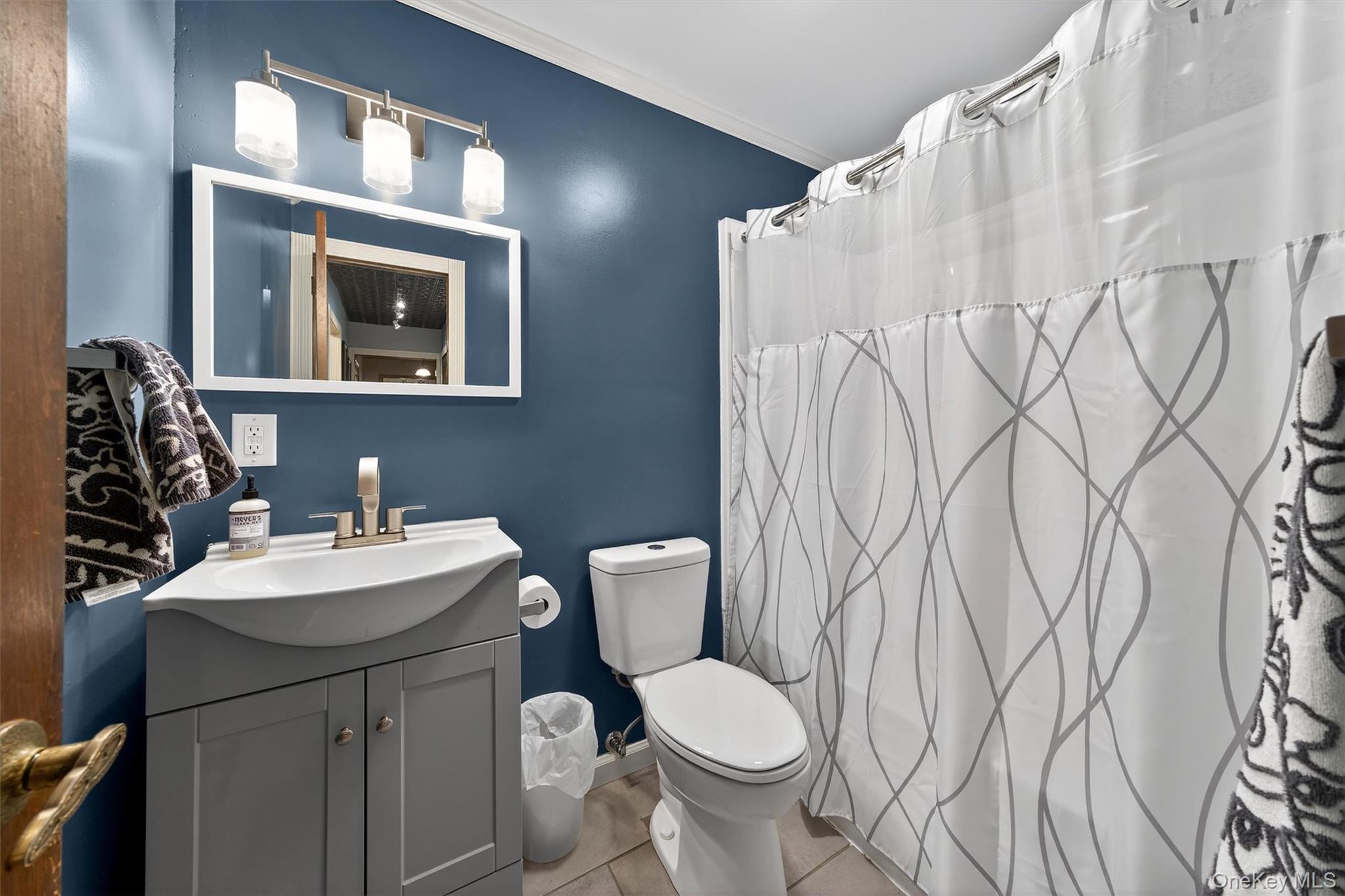 65 Bailey Road New Hampton, NY 10958 - Photo 21 of 50 Bathroom featuring curtained shower, vanity, ornamental molding, and tile patterned floors