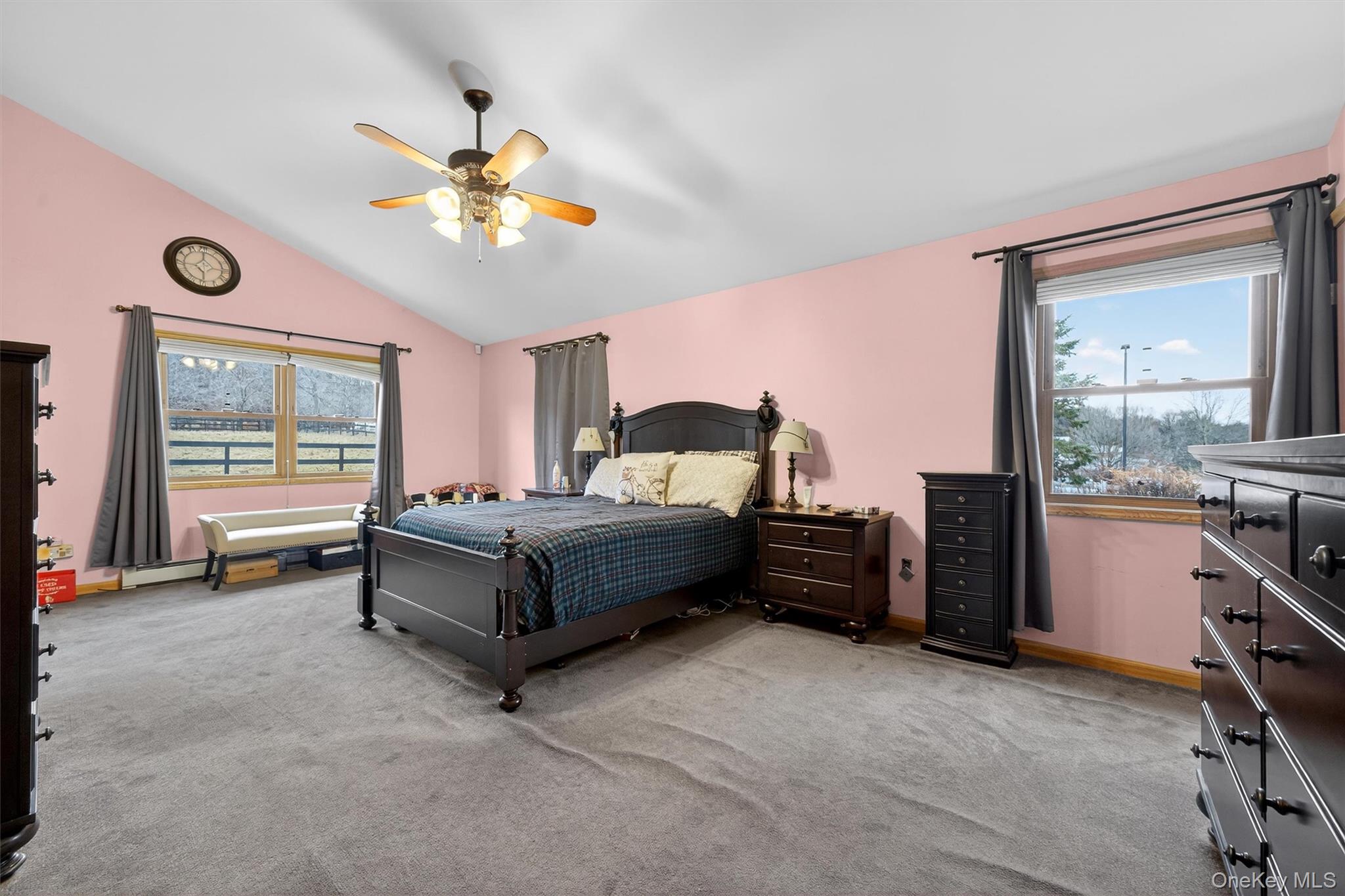 65 Bailey Road New Hampton, NY 10958 - Photo 22 of 50 a bedroom with a bed and a chandelier