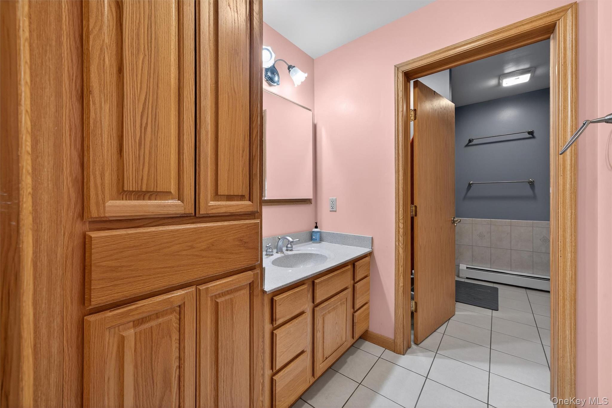 65 Bailey Road New Hampton, NY 10958 - Photo 25 of 50 a bathroom with a granite countertop sink and a mirror