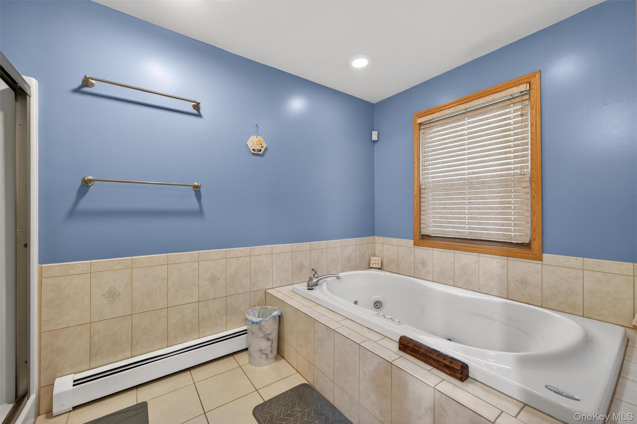 65 Bailey Road New Hampton, NY 10958 - Photo 27 of 50 a bathroom with a bathtub and a shower