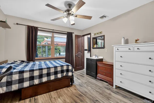 a backyard of a house with barbeque oven table and chairs