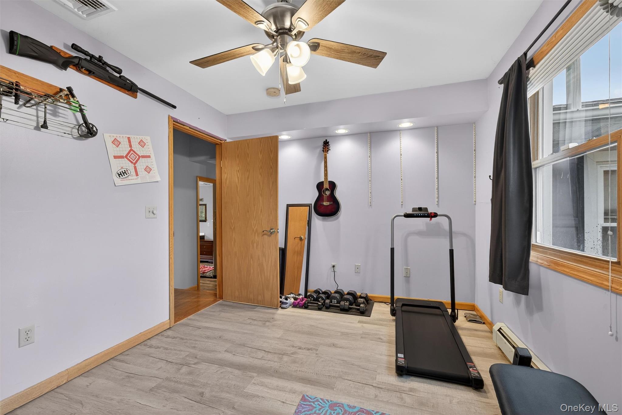 65 Bailey Road New Hampton, NY 10958 - Photo 36 of 50 Exercise room featuring wood finished floors, ceiling fan, and a baseboard radiator