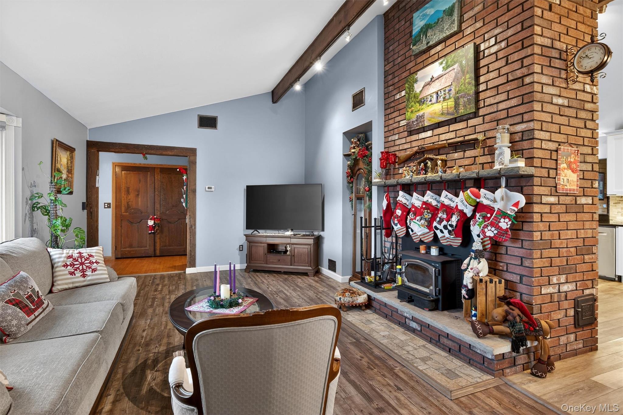 65 Bailey Road New Hampton, NY 10958 - Photo 8 of 50 a living room with furniture a flat screen tv and a fireplace