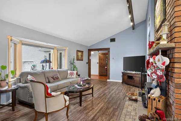 a dining room with furniture and window