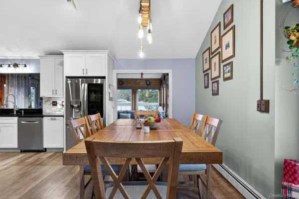 a kitchen with stainless steel appliances granite countertop a stove and cabinets
