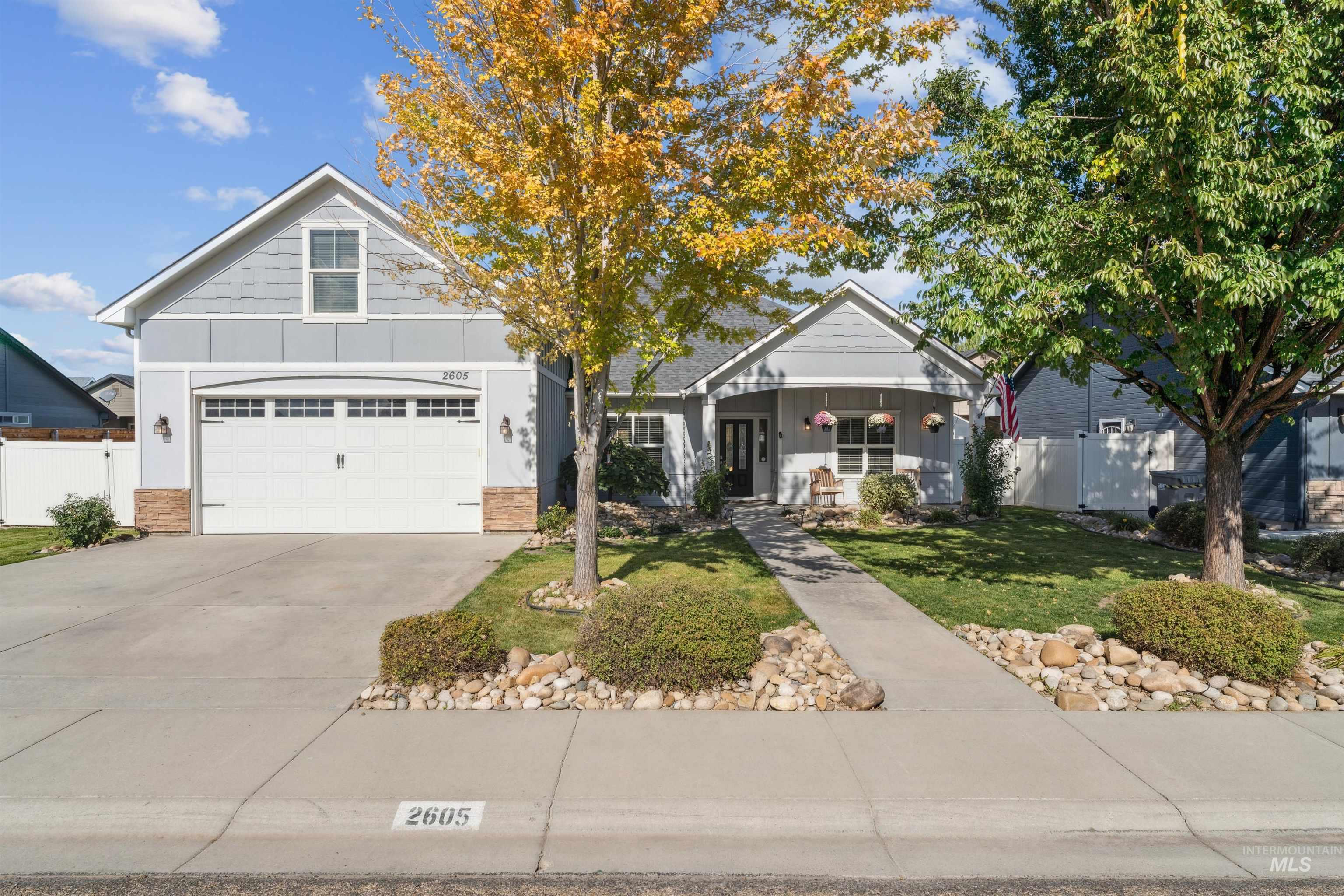 2605 Springcrest Street Caldwell, ID 83607 - Photo 1 of 1 View of front facade featuring board and batten siding, covered porch, concrete driveway, and an attached garage